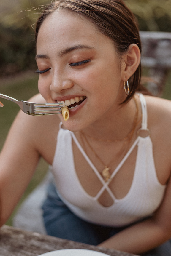 Woman Eating Pasta